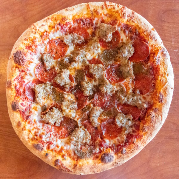 Bella's Pizza Villa's pepperoni and sausage pizza, with melted cheese and a golden crust.